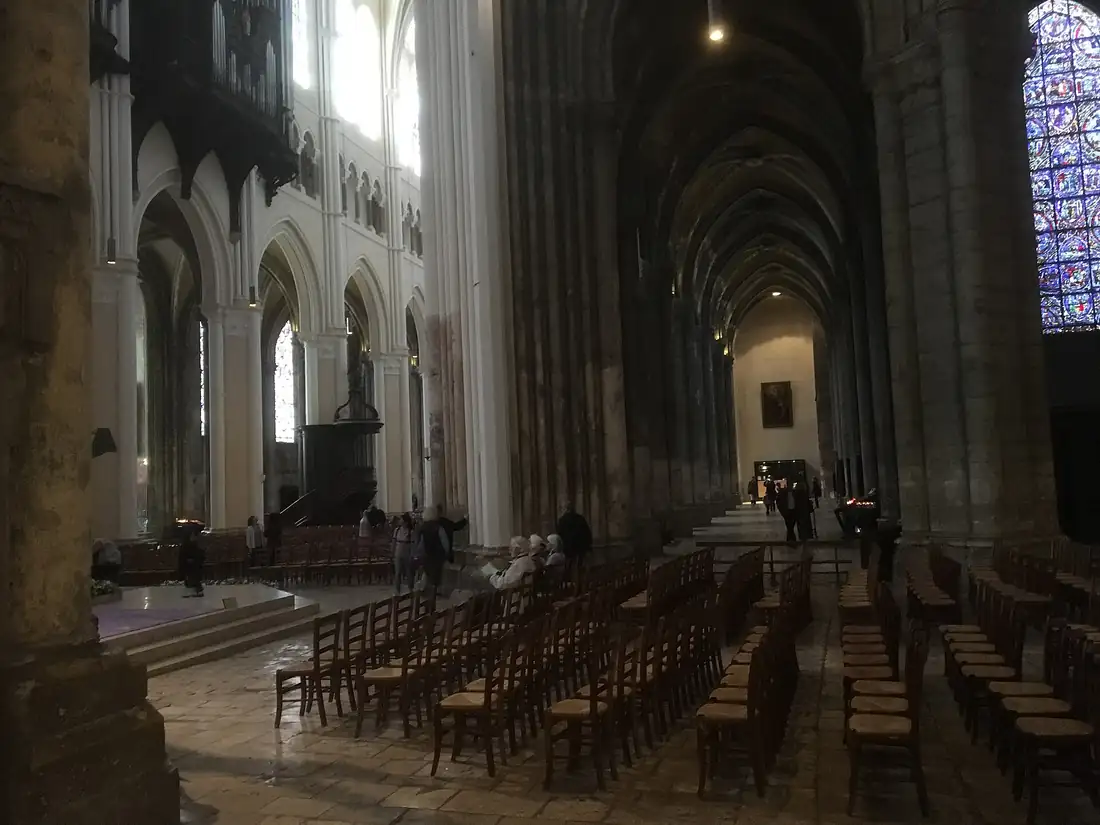 The nave of a cathedral, seen from the west door looking toward the altar.